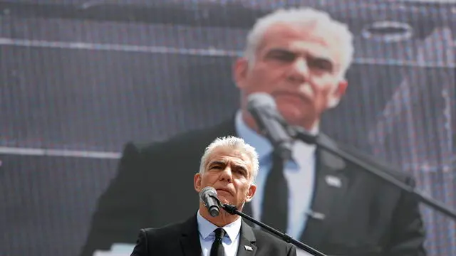 epa10545325 Former Israeli prime minister Yair Lapid adresses a rally against the judical overhaul plan outside the Knesset in Jerusalem, Israel, 27 March 2023. Mass protests have been held in Israel for 12 weeks against the government's plans to reform the justice system and limit the power of the Israeli Supreme Court. EPA/ATEF SAFADI