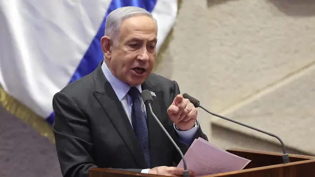 epa11166727 Israeli Prime Minister Benjamin Netanyahu speaks during the voting session for the impeachment of Hadash-Ta’al party MP Ofer Cassif in Jerusalem, 19 February 2024. The motion was brought up after Cassif publicly supported South Africa’s genocide case against Israel at the International Court of Justice (ICJ). EPA/ABIR SULTAN