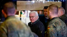 epa11174984 German President Frank-Walter Steinmeier speaks to German soldiers during a demonstration by the German armed forces Bundeswehr, in Klietz, Germany, 23 February 2024. The Special Training Command of the EU training mission EUMAM and the Bundeswehr's mobile logistics troops are training Ukrainian soldiers at the site. EPA/HANNIBAL HANSCHKE