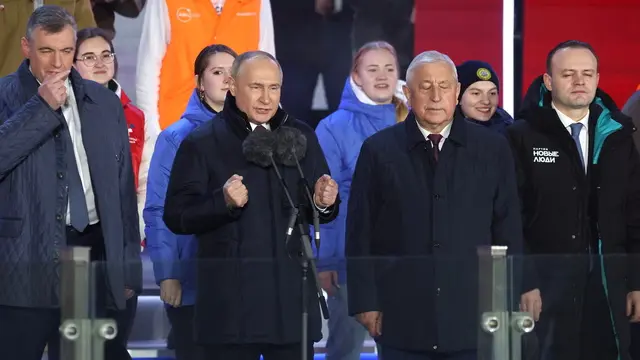 epa11228321 Russian President and presidential candidate Vladimir Putin (2-L) and presidential candidates Nikolai Kharitonov (2-R), Leonid Slutsky (L), Vladislav Davankov (R) attend a concert marking the 10th anniversary of Crimea's reunification with Russia at the Red Square in Moscow, Russia, 18 March 2024. In February 2014 Russian forces invaded and seized control of the Crimean Peninsula. Russia declared the annexation of Crimea on 18 March 2014, two days after the celebration of a so called 'referendum' in that territory. In a vote that reaffirmed Ukraine's 'national unity and territorial integrity', the United Nations General Assembly in the Resolution 68/262 condemned the referendum in Crimea stating it had 'no validity'. After the annexation, Moscow escalated its military presence on the peninsula to solidify the new status quo on the ground and since 2015, Russia approved the 'Day of Reunification of Crimea with Russia' as a holiday marked annually on 18 March. EPA/SERGEI ILNITSKY