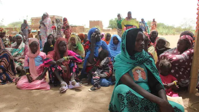 On 27 April 2023, as conflict escalates in Sudan, a group of refugees, mostly women and children, rest under a tree to protect themselves from the high temperatures after crossing into the Chadian village of Koufroun, which is situated on the Chad-Sudan border.