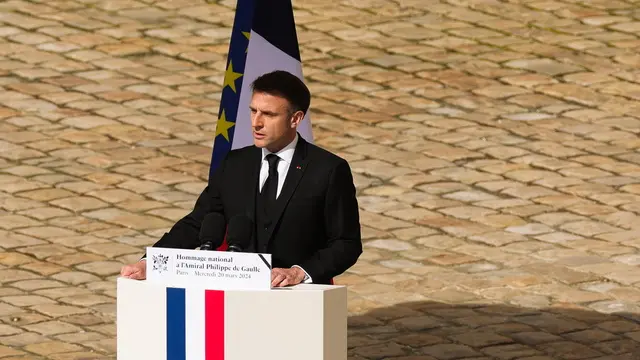 epa11231123 French President Emmanuel Macron walks gives an speech during the ceremony to pay tribute to Philippe De Gaulle, son of general Charles De Gaulle, in the courtyard of the Hotel des Invalides in Paris, France, 20 March 2024. Philippe De Gaulle, son of general Charles De Gaulle, has died at age 102 on 13 March 2024. EPA/TERESA SUAREZ