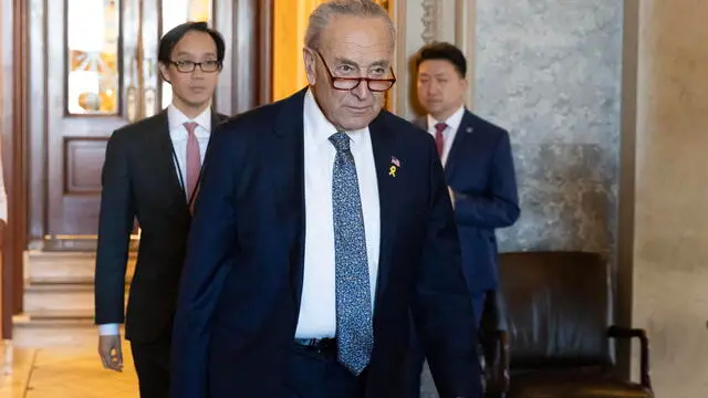 epa11220814 US Senate Majority Leader Chuck Schumer (C) leaves the Senate chamber following a Senate vote on Capitol Hill in Washington, DC, USA, 14 March 2024. Schumer delivered remarks on the Senate floor sharply criticizing the government of Israeli Prime Minister Benjamin Netanyahu over the situation in Gaza, and called for a new election in Israel. Schumer's remarks met swift criticism from Senate Minority Leader Mitch McConnell. EPA/MICHAEL REYNOLDS