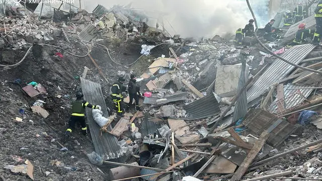 epa11236123 A handout photo made available by the State Emergency Service shows rescuers at work at the scene of a missile strike in the city of Khmelnytskyi, Ukraine, 22 March 2024, amid the Russian invasion. At least two people were killed and eight others were injured in Khmelnytskyi, the State emergency Service reported. According to the Air Force Command of the Armed Forces of Ukraine, Russia has launched projectiles against over 151 targets across Ukraine. The Ukrainian army intercepted 92 of them. EPA/STATE EMERGENCY SERVICE HANDOUT HANDOUT EDITORIAL USE ONLY/NO SALES HANDOUT EDITORIAL USE ONLY/NO SALES