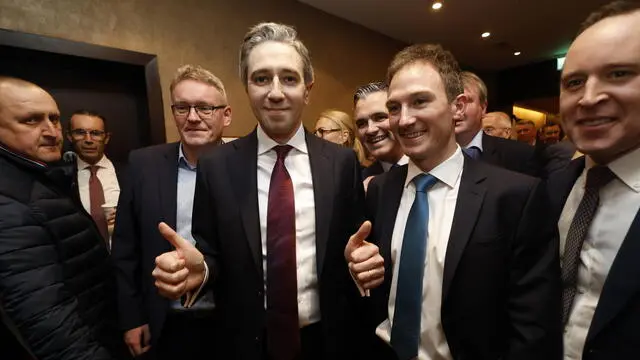 epa11241279 Ireland's Minister for Further and Higher Education, Simon Harris (C) gives the thumbs up ahead of a leadership announcement at the Sheraton Hotel in Athlone, Ireland, 24 March 2024. Following a shortened leadership contest, Simon Harris is expected to be declared the new leader of the Fine Gael party, which would pave the way for him to become Ireland's youngest Prime Minister (Taoiseach) following the resignation of Leo Varadkar. EPA/DAMIEN EAGERS