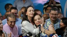 epa11237632 Anti-Chavista leader Maria Corina Machado (C-L) presents historian Corina Yoris (C-R) as a candidate for the presidential elections on 28 July, in view of the disqualification that prevents Machado from competing, in Caracas, Venezuela, 22 March 2024. In statements to the press, Machado assured that the decision "emerged from the discussion of the unitary forces" and is part of an agreed mechanism to "face this obstacle," in reference to her disqualification, ratified in January by the Supreme Court of Justice (TSJ), a sanction described it as "an irrational, totally unconstitutional and cowardly act." EPA/Rayner Pena R.