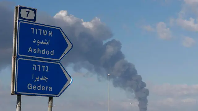 epa10904605 Smoke rising after over the Israeli city of Ashdod following rocket launches from Gaza, 07 October 2023. Rocket barrages were launched from the Gaza Strip early Saturday in a surprise attack claimed by the Islamist movement Hamas. EPA/ATEF SAFADI