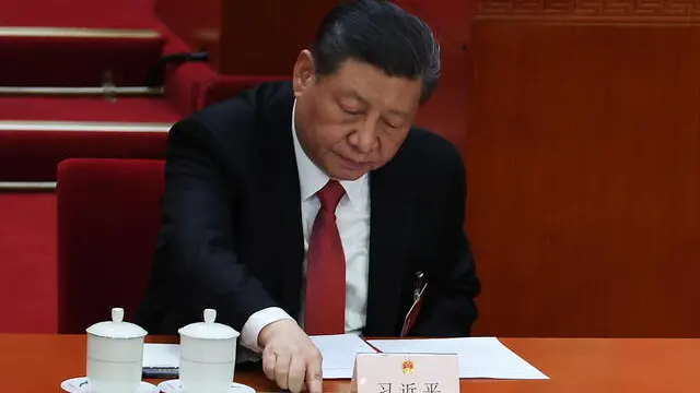 epa11213658 Chinese President Xi Jinping votes during the closing meeting of the second session of the 14th National People's Congress (NPC) at the Great Hall of the People in Beijing, China, 11 March 2024. China holds two major annual political meetings, the National People's Congress (NPC) and the Chinese People's Political Consultative Conference (CPPCC), which run alongside each other and are known as 'Lianghui' or 'Two Sessions.' EPA/WU HAO