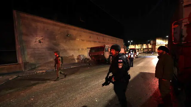 epa11155365 Israeli police and explosive experts inspect a building hit by rockets which they said were launched from southern Lebanon toward the border town of Kiryat Shmona, northern Israel, 15 February 2024. According to the police, there was no casualities. Earlier the same day, Lebanese state media said at least eight people were killed in an Israeli strike on a residential building in the city of Nabatiyeh late on 14 February 2024. The Israeli army did not comment on the incident. EPA/ATEF SAFADI