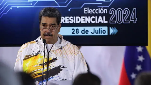 epa11243496 President of Venezuela Nicolas Maduro speaks after making his candidacy official for the presidential elections on July 28, in which he will compete for a third period in power, at the headquarters of the National Electoral Council (CNE) in Caracas, Venezuela, 25 March 2024. The Chavista leader went to the headquarters of the electoral body after participating in a march called by the ruling United Socialist Party of Venezuela (PSUV) in support of his registration, with which he becomes the tenth politician to make his aspiration official, a few hours before the deadline established in the schedule for the presentation of candidatures. EPA/Rayner Pena R.