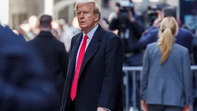 epa11243231 Former US president Donald Trump (C) departs 40 Wall Street after a press conference about his case in criminal court in New York, New York, USA, 25 March 2024. A judge ruled on 25 March that the hush-money trial against former US President Trump will begin on 15 April 2024. Trump is facing 34 felony counts of falsifying business records related to payments made to adult film star Stormy Daniels during his 2016 presidential campaign. EPA/SARAH YENESEL