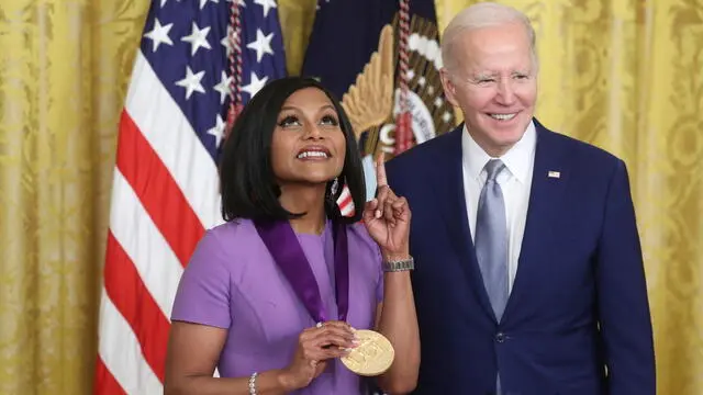 epa10535684 US President Joe Biden (R) presents Mindy Kaling a National Medal of Arts during a ceremony for the recipients of the 2021 National Humanities Medal and the 2021 National Medal of Arts, in the East Room of the White House in Washington, DC, USA, 21 March 2023. The ceremony for the recipients of the 2021 medals was previously delayed due to the COVID-19 pandemic. EPA/MICHAEL REYNOLDS
