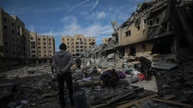 epa11220389 A man looks at the rubble of the Hamad towers after they were destroyed in an Israeli military operation in Khan Younis town, southern Gaza Strip, 14 March 2024. More than 31,000 Palestinians and over 1,300 Israelis have been killed, according to the Palestinian Health Ministry and the Israel Defense Forces (IDF), since Hamas militants launched an attack against Israel from the Gaza Strip on 07 October 2023, and the Israeli operations in Gaza and the West Bank which followed it. EPA/MOHAMMED SABER