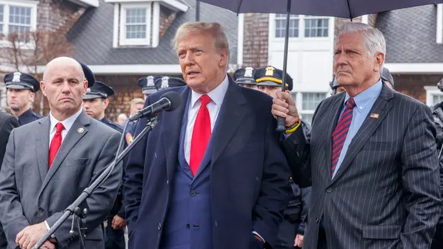 epa11248594 Former U.S. President Donald Trump (C) speaks to the press after attending the wake of slain New York City Police Department officer Jonathan Diller in Massapequa, New York, USA, 28 March 2024. Diller died at the hospital after he was shot during a routine traffic stop in Far Rockaway, Queens, New York City on Monday 25 March. EPA/SARAH YENESEL