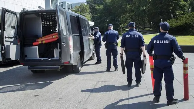 epa06888484 A police officers are seen outside the Finlandia House in Helsinki, Finland, 14 July 2018. US President Donald J. Trump and Russian President Vladimir Putin have agreed to meet for summit talks on 16 July 2018 in Helsinki. EPA/MAURI RATILAINEN