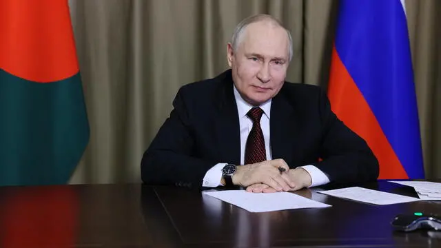 epa10901441 Russian President Vladimir Putin takes part in a ceremony marking the delivery of Russian nuclear fuel to the first power unit of the Rooppur NPP in Bangladesh, via videoconference call, in Sochi, Krasnodar region, Russia, 05 October 2023. The Russian state corporation Rosatom is building the Rooppur nuclear power plant in Bangladesh on the basis of an intergovernmental agreement signed in 2011. The nuclear power plant will consist of two power units with a total capacity of 2,400 megawatts. The delivery of nuclear fuel to the station gives it the status of a nuclear facility. This is one of the stages of construction of a nuclear power plant, after which they prepare for commissioning and later commissioning. EPA/MIKHAIL METZEL/SPUTNIK/KREMLIN / POOL MANDATORY CREDIT