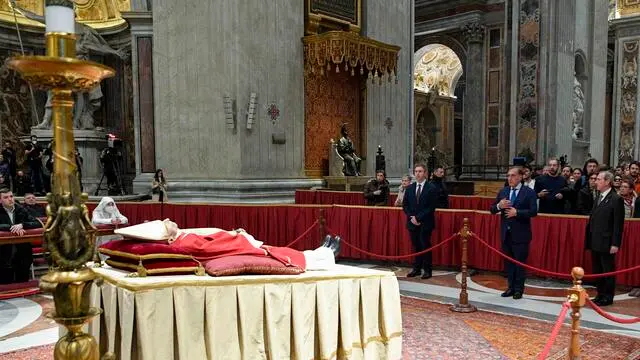 A handout picture, provided by Vatican Media Press Office, shows Italian President of the Senate, Ignazio La Russa, while paying homage to the body of His Holiness Benedict XVI exposed in Saint Peter’s Basilica, Vatican City, 03 January 2022. The Pope emeritus Benedict XVI will be buried immediately after the funeral ceremony and inside the coffin will have coins and medals minted during his pontificate and pallii, or liturgical vestments had during his ecclesiastical career. This was announced by the director of the Vatican press office, Matteo Bruni, during a briefing with international journalists in view of the funeral of the Pontiff. NPK ANSA / Vatican Media Press Office handout +++ ANSA PROVIDES ACCESS TO THIS HANDOUT PHOTO TO BE USED SOLELY TO ILLUSTRATE NEWS REPORTING OR COMMENTARY ON THE FACTS OR EVENTS DEPICTED IN THIS IMAGE; NO ARCHIVING; NO LICENSING +++