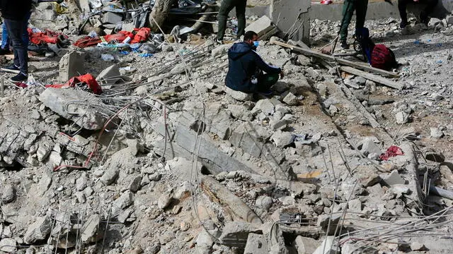 epa11246443 A man sits on rubble at the site of an airstrike in Habbariyah, southern Lebanon, 27 March 2024. Lebanese state media said seven medics were killed and four were injured in an Israeli airstrike early 27 March targeting the Jamaa Islamiya's emergency and relief center in the Hasbaya town of Habbariyah. Hezbollah condemned the attack in a statement saying that this aggression 'will not pass without retaliation and punishment'. The Israel Defense Forces (IDF) said fighter jets struck a 'military compound' in the area of Habbariyah, killing a 'significant operative' belonging to the Jamaa Islamiya 'who advanced attacks against Israel'. EPA/STR