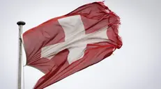 epa08208298 A view of a damaged Swiss flag waving during stormy weather in Echallens, Switzerland, 10 February 2020. Severe warnings have been issued for Western and Northern Europe as storm Ciara -- also known as Sabine in Germany and Switzerland, and Elsa in Norway -- is bringing strong winds and heavy rains causing disruption of land and air traffic. Winter storm Ciara reached Switzerland last night. EPA/LAURENT GILLIERON