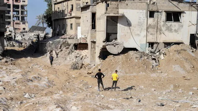 epa11254412 Palestinians inspect the damages at and near Al-Shifa Hospital after the Israeli army withdrew from it following a two-week military operation, in Gaza City, 01 April 2024. An Israeli army spokesperson reported that Israeli forces completed operations at Al-Shifa hospital with about 500 affiliated suspects arrested and 200 eliminated. More than 32,700 Palestinians and over 1,450 Israelis have been killed, according to the Palestinian Health Ministry and the Israel Defense Forces (IDF), since Hamas militants launched an attack against Israel from the Gaza Strip on 07 October 2023, and the Israeli operations in Gaza and the West Bank which followed it. EPA/MOHAMED HAJJAR