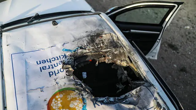 epaselect epa11255114 A destroyed car of the NGO World Central Kitchen (WCK) sits along Al Rashid road, between Deir Al Balah and Khan Younis in the southern Gaza Strip, 02 April 2024. NGO World Central Kitchen (WCK) confirmed in a statement on 02 April that seven of its members were killed in an Israeli strike, when a missile hit their convoy in Deir al Balah while they were on their way from Rafah to Gaza City to receive fresh aid delivered by the Open Arms vessel. The victims were confirmed to be from Australia, Poland, United Kingdom, a dual citizen of the U.S. and Canada, and Palestine. The World Central Kitchen announced it has suspended its activities in the region. EPA/MOHAMMED SABER