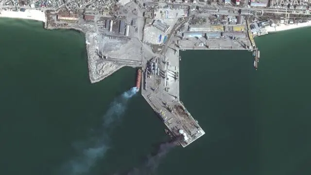 epa09849285 A handout satellite image made available by Maxar Technologies shows a burned and partially submerged ship (C, bottom) near one of the port's loading/unloading quays, in the southern Ukrainian port city of Berdyansk, Ukraine, 25 March 2022. The Ukrainian Navy said on 24 March, that the 'Orsk' naval transport vessel of Russia's Black Sea Fleet was destroyed in the Russian-occupied port of Berdyansk. EPA/MAXAR TECHNOLOGIES HANDOUT -- MANDATORY CREDIT: SATELLITE IMAGE 2022 MAXAR TECHNOLOGIES -- THE WATERMARK MAY NOT BE REMOVED/CROPPED -- HANDOUT EDITORIAL USE ONLY/NO SALES