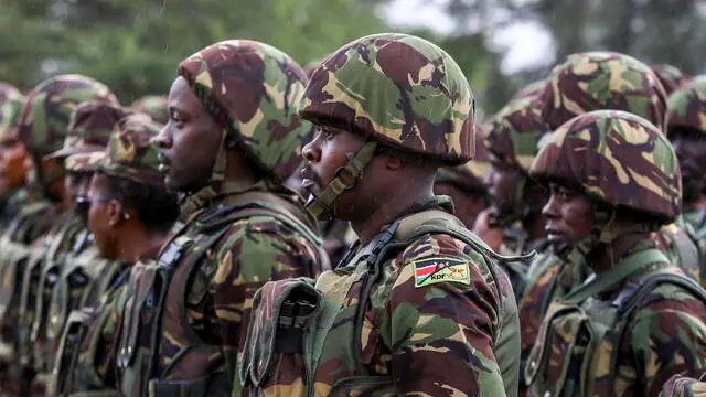 epa10281342 Kenya Defence Forces (KDF) soldiers parade during a flag presentation ceremony by Kenya's President William Ruto before their deployment to the Democratic Republic of Congo (DRC) as part of the East Africa Community Regional Force (EARDC) at the Embakasi Garrison in Nairobi, Kenya, 02 November 2022. Deployment of Kenyan troops to the DRC follows a decision endorsed and adopted by regional leaders at the third East Africa Community Heads of State conclave on Peace and Security in eastern DRC, held in Nairobi in June 2022. The Conclave agreed to have the EARDC to quell a flare up of violence in the Eastern DRC. EPA/DANIEL IRUNGU