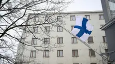 epa11256485 A Finish flag flies at half-mast during a day of mourning after a school shooting in Helsinki, Finland, 03 April 2024. According to police, one 12-year-old child died, and two others were injured in a shooting incident in a school in Vantaa on 02 April. The suspect, also aged 12, fled the scene but was later arrested. EPA/KIMMO BRANDT