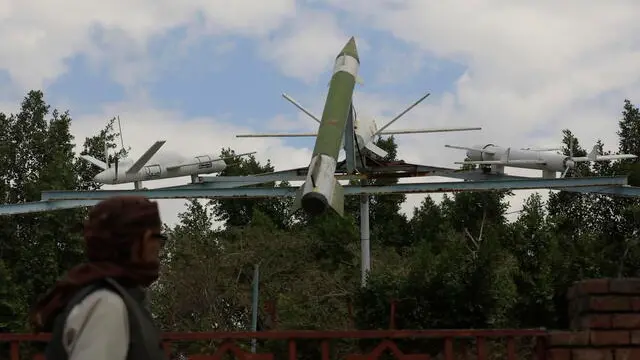 epa11137420 A person passes a display of mock Houthis-made drones and missile at a square in Sana'a, Yemen, 08 February 2024. The top leader of Yemen's Houthis, Abdul-Malik al-Houthi, said in a televised address, that his group had managed to stop the navigation of Israel-linked ships through the Bab al-Mandeb Strait, just hours after the United States Central Command (CENTCOM) attacked missiles from the Houthis that were ready to be launched against merchant ships in the Red Sea. The Houthis have kept up drone and missile attacks on ships in the Red Sea and the Gulf of Aden, with the aim of ending the Israeli bombardment of the Gaza Strip, and in response to US-led retaliatory strikes. In January 2024, the US Department of State designated Yemen's Houthis as a 'Specially Designated Global Terrorist group' due to their increased attacks on shipping lanes. In December 2023, the US Department of Defense announced a multinational operation to safeguard trade and protect ships in the Red Sea in response to the escalation of Houthi attacks. EPA/YAHYA ARHAB
