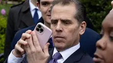 epa11254819 Hunter Biden, son of US President Joe Biden, looks at his mobile phone as he attends the 2024 Easter Egg Roll on the South Lawn of the White House in Washington, DC, USA, 01 April 2024. About forty thousand people were expected to attend the 2024 Easter Egg Roll, which continues the theme of 'EGGucation' and provides a variety of learning activities for children. EPA/MICHAEL REYNOLDS / POOL