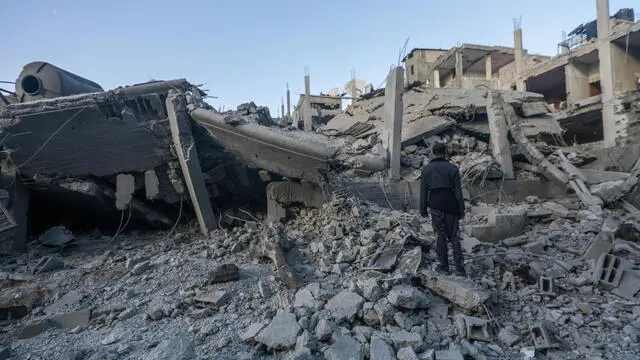 epa11198374 A Palestinian stands over the rubble of a destroyed house following Israeli air strikes in Al Nusairat refugee camp, Gaza Strip, 04 March 2024. More than 30,500 Palestinians and over 1,300 Israelis have been killed, according to the Palestinian Health Ministry and the Israel Defense Forces (IDF), since Hamas militants launched an attack against Israel from the Gaza Strip on 07 October 2023, and the Israeli operations in Gaza and the West Bank which followed it. EPA/MOHAMMED SABER