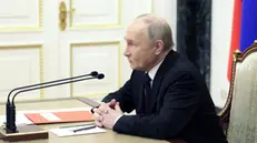 epa11273222 Russia President Vladimir Putin holds a videoconference meeting to discuss the flood aftermath in the Orenburg, Kurgan, and Tyumen regions, in Moscow, Russia, 11 April 2024. Regional governor Denis Pasler informed Russian President Vladimir Putin that the flood situation in the Orenburg region has reached its peak. The most difficult situation is in Orenburg. According to the Russian Ministry of Emergency Situations, the water level in the Ural River has risen to 1060 cm. There are 2028 residential buildings and 2522 household plots remaining in the flood zone. The authorities of the Orenburg region have reported that 7,800 people, including 2,117 children, have been evacuated from flooded homes and personal plots. The most challenging flood situation remains in Orsk, Orenburg, Orenburg, and Ilek regions. EPA/GAVRIIL GRIGOROV/SPUTNIK/KREMLIN POOL MANDATORY CREDIT