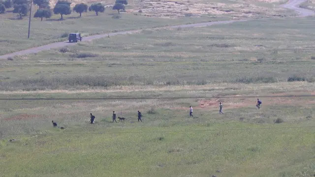 epa11275990 Israeli settlers search for a missing 14-year-old near the the West Bank village of Al-Mughayyir, near Ramallah, 13 April 2024. According to the Palestinian Health Ministry, at least one Palestinian was killed and 27 others were wounded, while dozens of vehicles and houses were set ablaze by settlers, during clashes that erupted the previous night amid an Israeli operation in the area. The IDF and Israel's police confirmed a search operation was ongoing for a missing Israeli teenager. EPA/ALAA BADARNEH