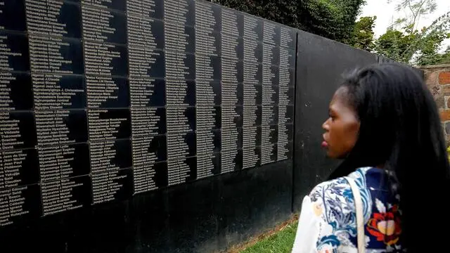 epa07485109 (FILE) - A woman looks through names of Genocide victims on a board at the Kigali Genocide memorial in Kigali, Rwanda, 03 August 2017 (reissued 04 April 2019). Rwanda is marking the 25th anniversary a historic genocide triggered by the assassination of Rwandan president Juvenal Habyarimana, who was an ethnic Hutu, on 06 April 1994. Subsequently, Hutus started to slaughter the Tutsis all over the country. It is believed that about 800,000 people were massacred over the period of some 100 days in Rwanda. EPA/AHMED JALLANZO