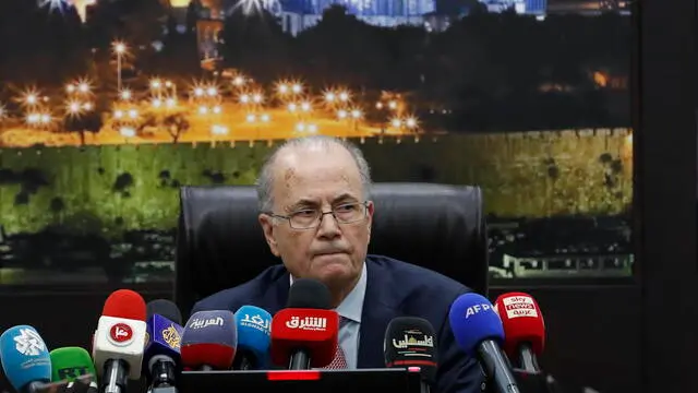 epa11255228 The new Prime Minister of the State of Palestine Mohammad Mustafa heads the first meeting of the new government, at the Palestinian government headquarter in the West Bank town of Ramallah, 02 April 2024. Palestinian President Mahmoud Abbas chose the 69-year-old business figure Mohammad Mustafa for the post of Prime Minister and asked him to form a government, after Mohammad Shtayyeh resigned as prime minister in February 2024. EPA/ALAA BADARNEH