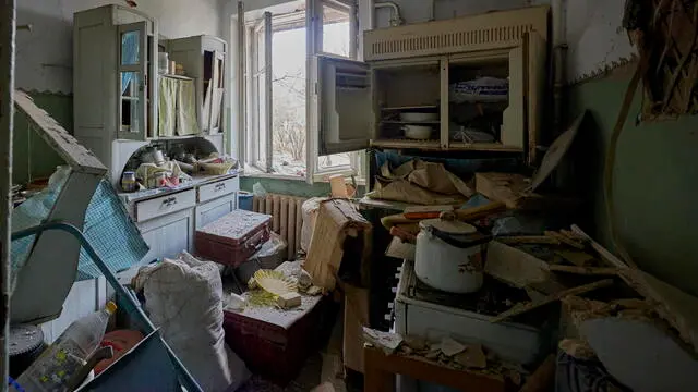 epa11264337 A flat damaged as a result of a rocket attack on a residential area in Kharkiv, northeastern Ukraine, 07 April 2024, amid the Russian invasion. At least four people were wounded in the rocket attack, according to a report by the State Emergency Service. Russian troops entered Ukrainian territory on 24 February 2022, starting a conflict that has provoked destruction and a humanitarian crisis. EPA/SERGEY KOZLOV