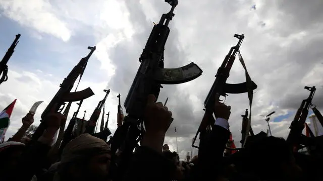 epa11260960 Houthi supporters hold up weapons during a rally marking the Al-Quds Day, in Sana'a, Yemen, 05 April 2024. Thousands of Houthi supporters took part in the rally to commemorate the day in solidarity with the Palestinian people. Al Quds Day was declared in 1979 by the late Ayatollah Khomeini, founder of the Islamic Iranian Republic, who called on the world's Muslims to show solidarity with Palestinians on the last Friday of the fasting month of Ramadan. EPA/YAHYA ARHAB