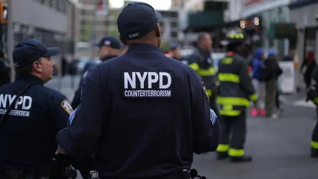 epa10579280 New York City Police Department Couterterrosim Unit officers work the scene of a parking structure collapse in the Financial District of New York City, New York, USA, 18 April 2023. Fire Department officials have reported three injuries but advised they expect that to increase. EPA/JUSTIN LANE