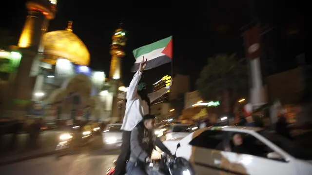 epa11277375 Iranians celebrate after Iran launched drone attacks against Israel at Palestine Square in Tehran, Iran, early morning of 14 April 2024. Iran's Islamic Revolutionary Guards Corps (IRGC) launched drones and rockets towards Israel late on 13 April 2024, Iranian officials said. EPA/ABEDIN TAHERKENAREH