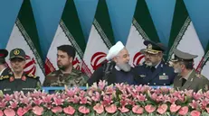 epa07513863 Iranian president Hassan Rouhani (C) chats with Iranian Army forces Brigadier General Aziz Nasirzadeh (R-2), and Iranian Commander-in-chief Abdolrahim Mousavi (R), as Iranian Islamic Revolutionary Guard Corps military commander General Mohammad Bagheri (L) looks on, during a ceremony marking the annual National Army Day in Tehran, Iran, 18 April 2019. According to media reports, President Rouhani, speaking at a military parade marking Army Day in the capital Tehran, called on countries across the Middle East to unite against the United States -- amid rising tensions between the two countries following the US classification of the Iranian Revolutionary Guards as a terrorist organization. EPA/ABEDIN TAHERKENAREH