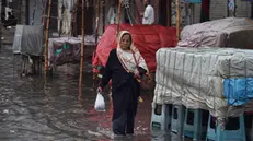 epa11278192 People make their way during heavy rain in Karachi, Pakistan, 14 April 2024. At least 29 people have died and another seven have been injured in the last two days due to lightning strikes and incidents related to the heavy rains affecting several provinces of Pakistan, rescue officials said. In total, 17 people died in the northeastern province of Punjab, in addition to eight deaths in southern Balochistan and four in northern Khyber Pakhtunkhwa. EPA/SHAHZAIB AKBER