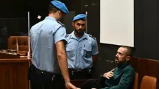 Alberto Scagni (D) l'omicida della sorella Alice, durante l'udienza prima della sentenza del Tribunale. Genova, 29 settembre 2023. ANSA/LUCA ZENNARO