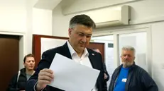 epa11283705 Incumbent Croatian Prime Minster Andrej Plenkovic casts his ballot during the Parliamentary elections in Zagreb, Croatia, 17 April 2024. Voters in the country are casting their ballots to elect 151 members of Sabor, the Parliament of Croatia. EPA/ANTONIO BAT