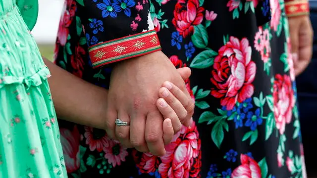 epa10102614 A Roma girl holds her mother's hand during a ceremony marking the Roma Holocaust Memorial Day, held at the Holocaust Memorial in Bucharest, Romania, 02 August 2022. The Roma Holocaust Memorial Day commemorates the victims of the Romani genocide which was committed against the Romani people by Nazi Germany and its allies during World War II. The European Parliament declared 02 August the European Holocaust Memorial Day for Sinti and Roma in 2015, in the memory of about 500,000 Sinti and Roma minorities murdered in Nazi-occupied Europe during the WWII. The Roma people are Europeâ€™s largest ethnic minority, estimated at 10 - 12 millions, from which about 6 millions are living withing the EU borders. Romania erected a Holocaust memorial in Bucharest on 08 October 2009 to commemorate the killing of more than a quarter million Jews and Roma by the Nazi-allied Romanian authorities during World War Two. EPA/ROBERT GHEMENT