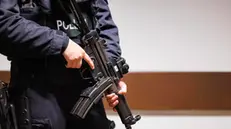 epa11056522 An armed police officer stands prior to the start of the trial for defendant Thomas Drach (not pictured) at the Regional Court in Cologne, Germany, 04 January 2024. Former Reemtsma kidnapper and suspected serial robber Drach has been charged with four robberies, as well as two counts of attempted murder. According to the indictment, the German is said to have robbed several cash-in-transit vehicles in Cologne, Frankfurt am Main, Limburg, and Hesse in 2018 and 2019. A verdict is expected on the 100th day of the trial. EPA/CHRISTOPHER NEUNDORF
