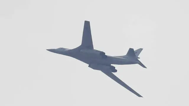epa09134387 A Russian Air Force Tupolev Tu-160 strategic bomber flys over town of Podolsk outside Moscow as the bomber takes part in a rehearsal for the Victory Day military parade at the Patriot Park in Alabino, Moscow region, Russia, 14 April 2021. The Victory Day parade at the Red Square on 09 May 2021 will mark the 76th anniversary of the capitulation of Nazi Germany in WWII. EPA/MAXIM SHIPENKOV