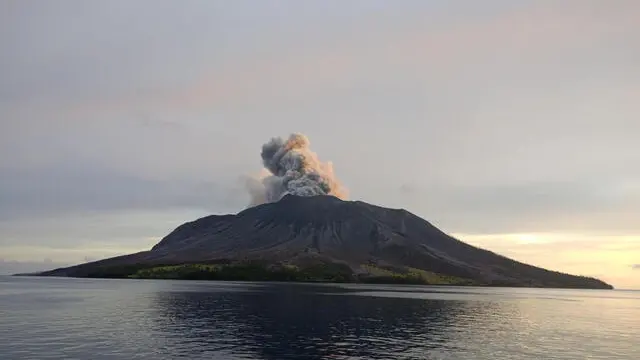 epa11288018 A handout photo made available by the Indonesian National Search and Rescue Agency (BASARNAS) shows smoke and ash erupting from Mount Ruang as seen from Tagulandang village, in North Sulawesi, Indonesia, 19 April 2024. The Center for Volcanology and Geological Disaster Mitigation (PVMBG) of the Ministry of Energy and Mineral Resources reported that Mount Ruang in the Sitaro Islands Regency, North Sulawesi, erupted on 16 April night. As a result of the eruption of Mount Ruang, 272 families, or around 828 people, were evacuated. EPA/BASARNAS HANDOUT HANDOUT EDITORIAL USE ONLY/NO SALES HANDOUT EDITORIAL USE ONLY/NO SALES HANDOUT EDITORIAL USE ONLY/NO SALES