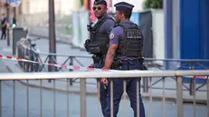 epa10724928 Police officers stand near the venue of the 'One Year to Go Paris 2024' (Dans un An Les Jeux Paris 2024) concert, held amid massive police presence following days of violent protests, in Paris, France, 03 July 2023. Violence broke out across France over the fatal shooting of a 17-year-old teenager by a police officer during a traffic stop in Nanterre on 27 June. EPA/OLIVIER MATTHYS