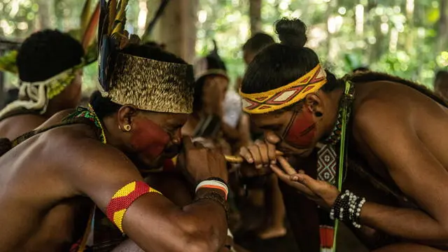 epa10530376 Members of the Pataxo indigenous tribe takes part in a traditional ritual at Aldeia Velha reserve, near Arraial D'Ajuda, Bahia state, Brazil, 08 March 2023 (issued 18 March 2023). Since 2000 the pataxos have kept open the link with tourists who want to learn about their customs. Today, tourism is their main source of livelihood. EPA/ANDRE COELHO