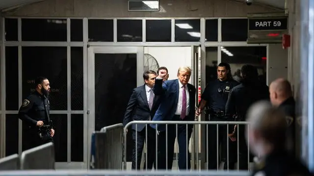 epa11288861 Former US President and current Republican presidential candidate Donald Trump (C) steps outside the courtroom during a break in his trial at Manhattan Criminal Court in New York, New York, USA, 19 April 2024. Trump is facing 34 felony counts of falsifying business records related to payments made to adult film star Stormy Daniels during his 2016 presidential campaign. EPA/Maansi Srivastava / POOL